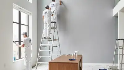 Interior house painters in Columbus, OH applying fresh wall paint in a home interior